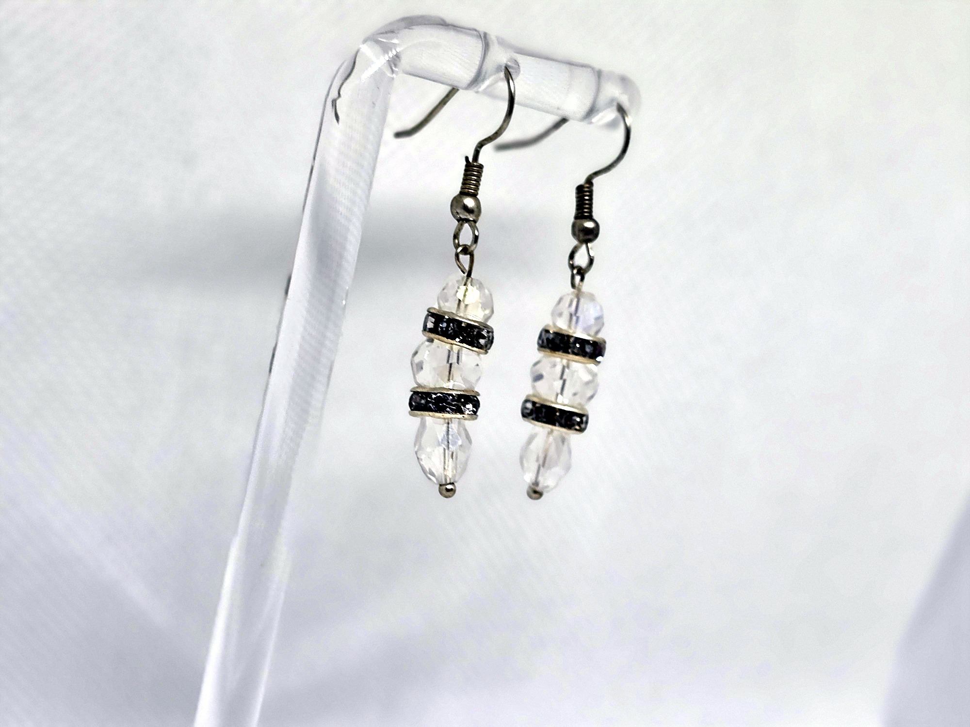 Handmade earrings photographed in a white light box